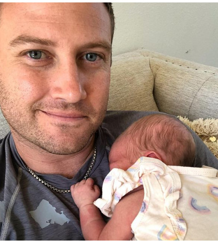 Samantha Papenbrook's husband, Bryce with their third baby